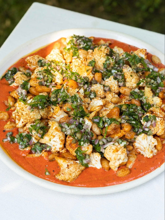 Roasted cauliflower and white beans with cashew red pepper sauce