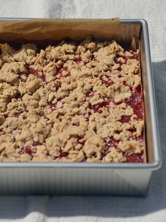Strawberry rhubarb peanut butter crumble bars with oat topping